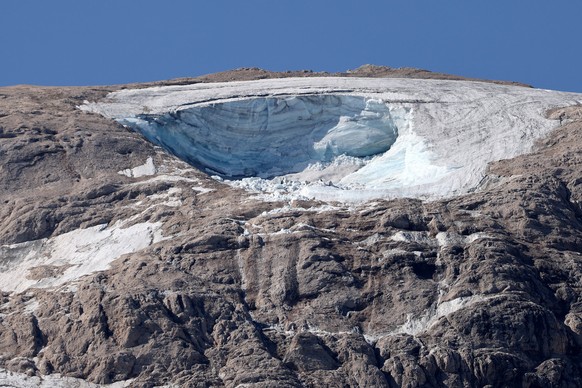 epa10051138 The missing part of a glacier that collapsed triggering an avalanche on the Marmolada Mountain, in Canazei, Italy, 04 July 2022. At least six people were killed and dozens were still missi ...