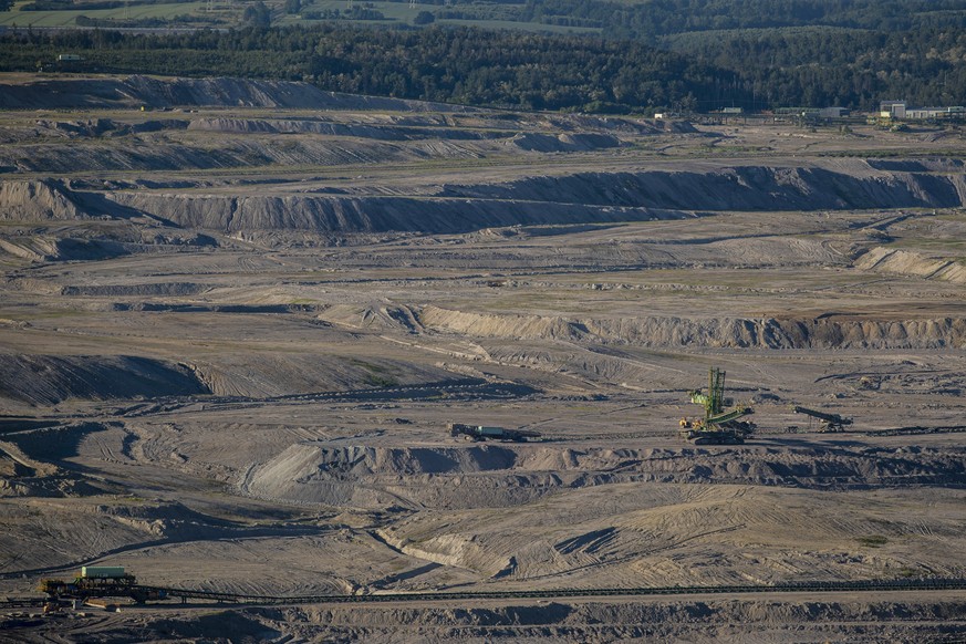 epa09271811 A giant belt spreader at the Turow lignite mine, operated by PGE company, in Bogatynia, Poland, 14 June 2021. According to Czech Environment Minister Brabec, the Czech Republic has sent a  ...