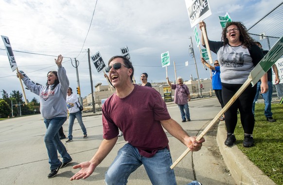 Jack Barber, 57, of Clio encourages drivers to honk for support as they drive past the Flint Assembly Plant in Flint, Mich., Sunday, Sept. 14, 2019. GM autoworkers officially go on strike at midnight  ...