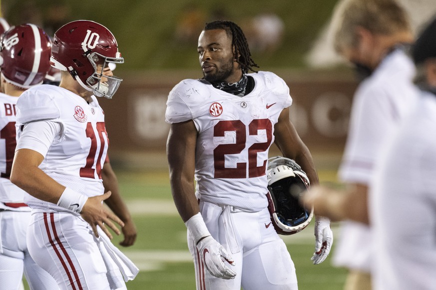 Alabama running back Najee Harris, right, jokes with quarterback Mac Jones, left, as they walk off the field during the second half of an NCAA college football game against Missouri, Saturday, Sept. 2 ...