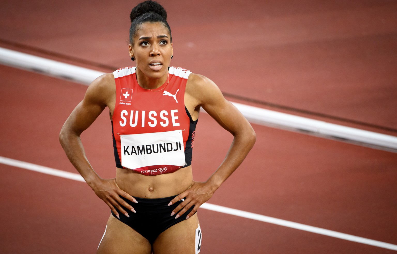 Mujinga Kambundji of Switzerland reacts after crossing the finish line after the women&#039;s athletics 200m final at the 2020 Tokyo Summer Olympics in Tokyo, Japan, on Tuesday, August 03, 2021. (KEYS ...
