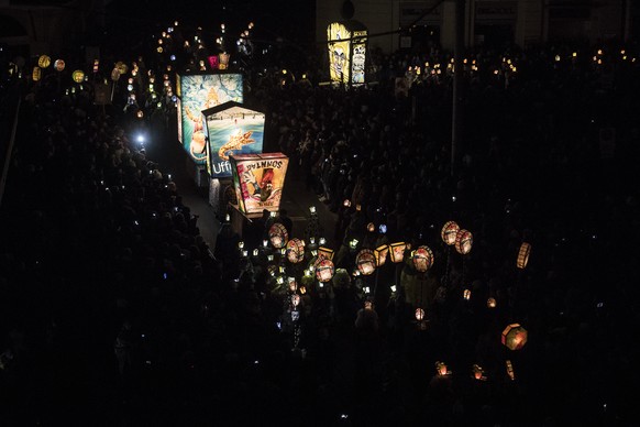 Revellers wearing masks and lanterns parade through the streets during the so-called &#039;Morgestraich&#039; in Basel, Switzerland, on early Monday morning, 19 Feburary 2018. The traditional &#039;Mo ...