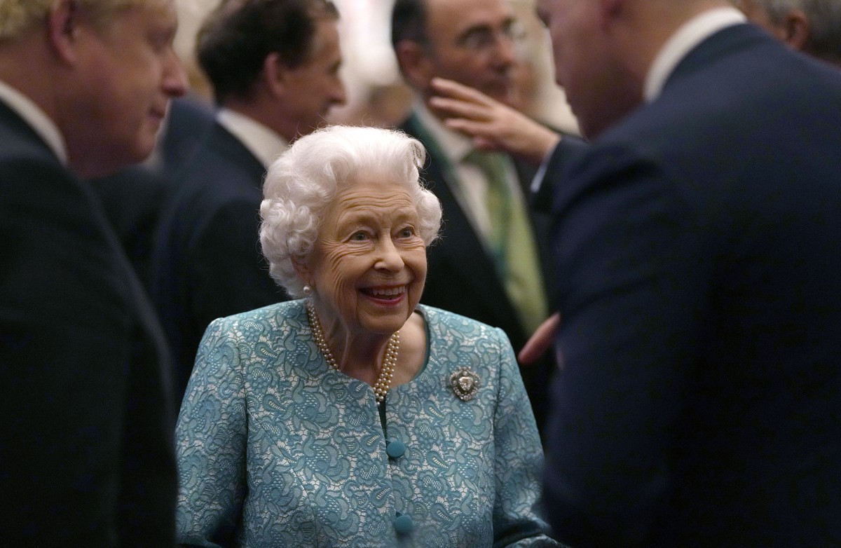 FILE - In this Tuesday, Oct. 19, 2021 file photo, Britain's Queen Elizabeth II and Prime Minister Boris Johnson, left, greet guests at a reception for the Global Investment Summit in Windsor Cast ...