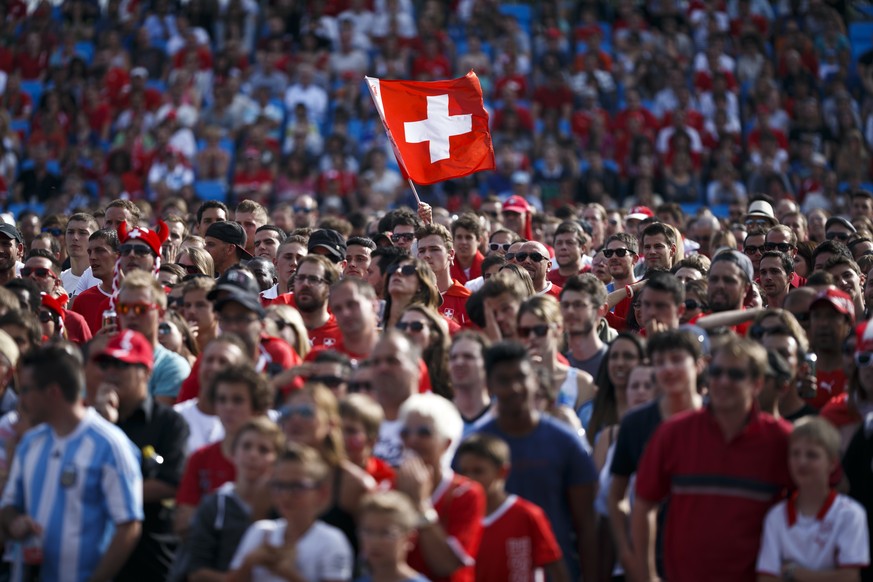 A Swiss flag is pictured during the World Cup round of 16 soccer match between Argentina and Switzerland in a fan zone in Lausanne this Tuesday, July 1, 2014. (KEYSTONE/Valentin Flauraud)