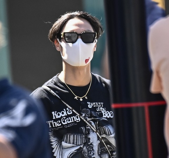 epa09584860 (FILE) - Chinese Formula 2 driver Guanyu Zhou (C) arrives for the third practice session of the Formula One Grand Prix of Austria in Spielberg, Austria, 03 July 2021 (re-issued on 16 Novem ...