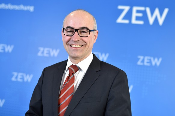 epa05204081 The new head of the Center of European Economic Research (ZEW), Achim Wambach, stands in front of the ZEW logo during a press conference in Mannheim, Germany, 10 March 2016. Wambach formil ...