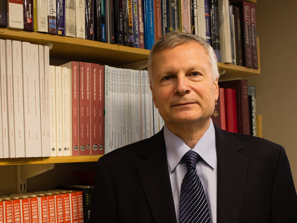 This Sept. 15, 2016, photo provided by Jessica De Simone shows author Dani Rodrik at his office at the Harvard Kennedy School in Cambridge, Mass. In Rodrik's new book, “Straight Talk on Trade: Id ...