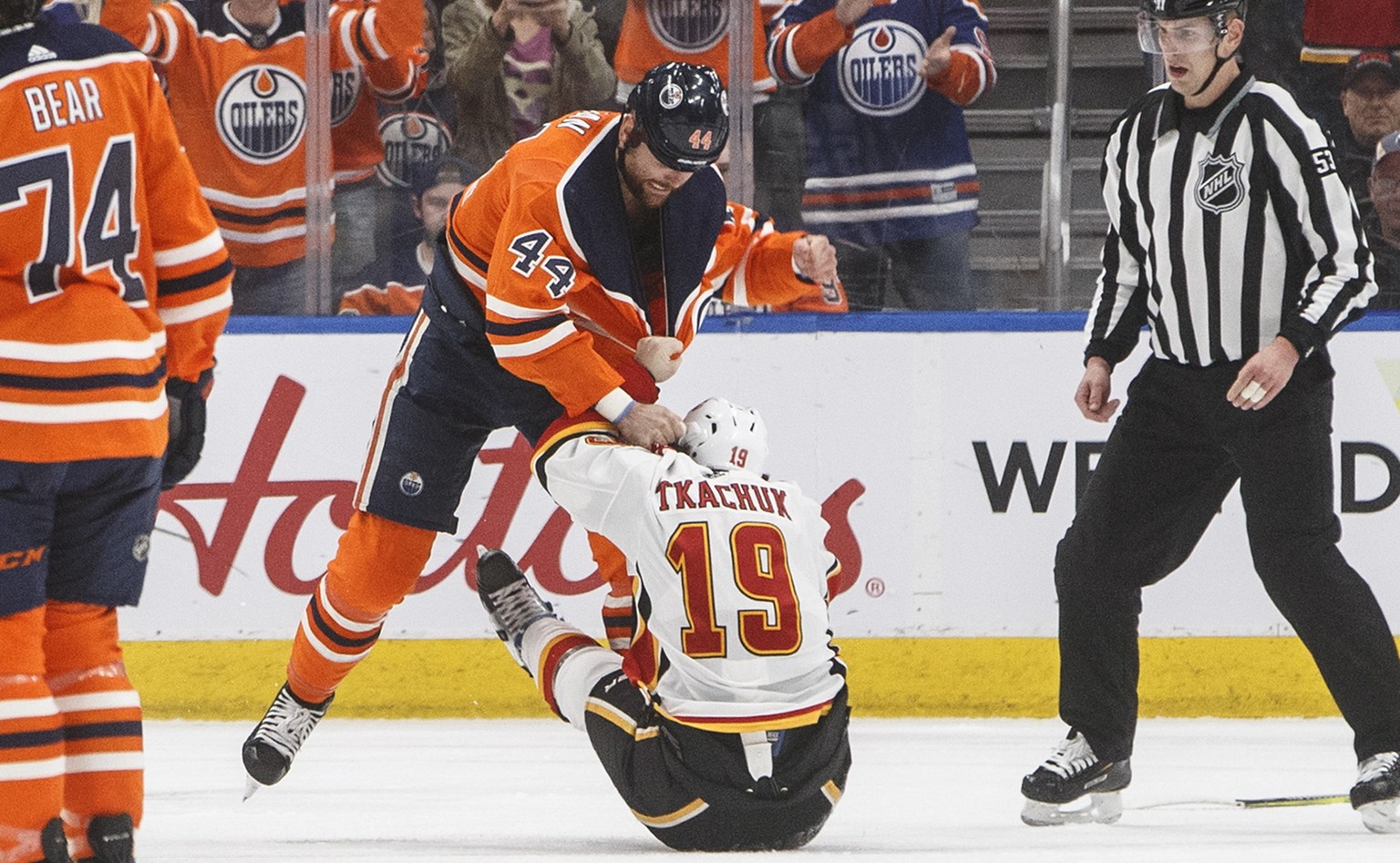 Calgary Flames&#039; Matthew Tkachuk (19) and Edmonton Oilers&#039; Zack Kassian (44) fight during the first period of an NHL hockey game Wednesday, Jan. 29, 2020, in Edmonton, Alberta. (Jason Franson ...