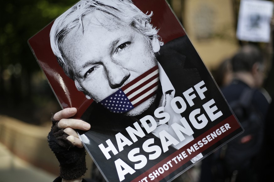 Protesters outside court as Julian Assange will appear to be sentenced on charges of jumping British bail seven years ago, in London, Wednesday May 1, 2019. Founder of WikiLeaks whistleblower site, As ...