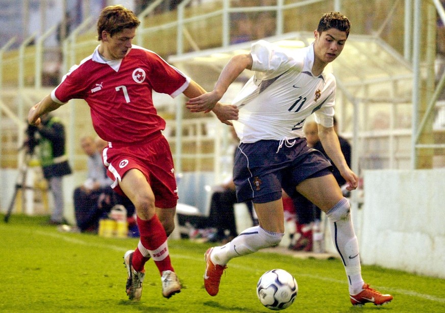 Swiss player Rijat Shala (L) pulls the jersey of Portuguese Cristiano Ronaldo (R) during a under-21 soccer match in at Faro&#039;s Sao Luis stadium Tuesday 11 February 2003. (KEYSTONE/EPA/LUSA / LUIS  ...