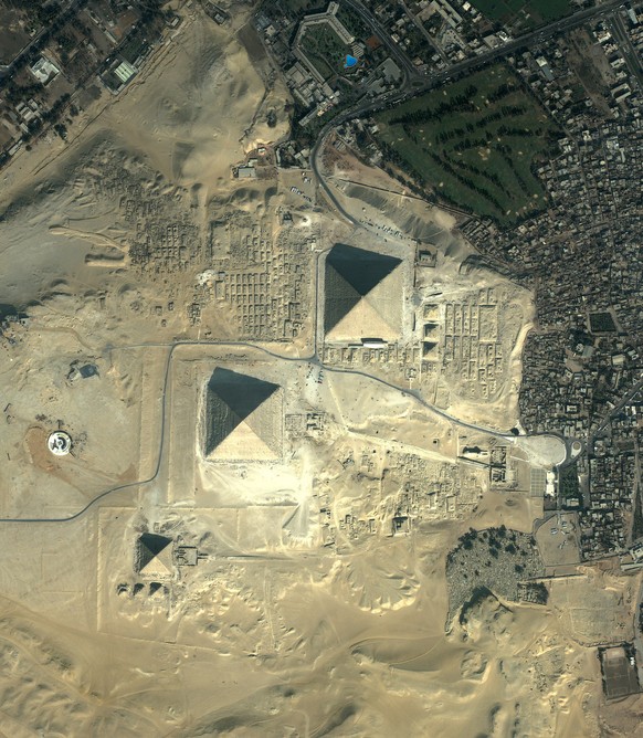 This undated image provided by the Smithsonian Institution shows The Giza Pyramids, and is part of an exhibit at the National Air and Space Museum in Washington entitled: Earth from Space. A dark blue ...