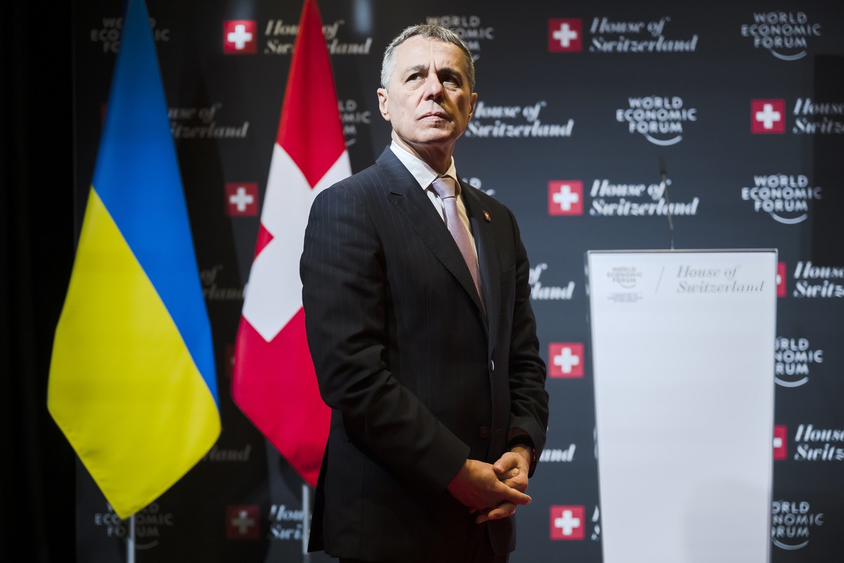 epa09972786 Ignazio Cassis, President of the Swiss Confederation, before a video meeting with Denys Shmygal, Prime Minister of Ukraine in the House of Switzerland, during the 51st annual meeting of th ...