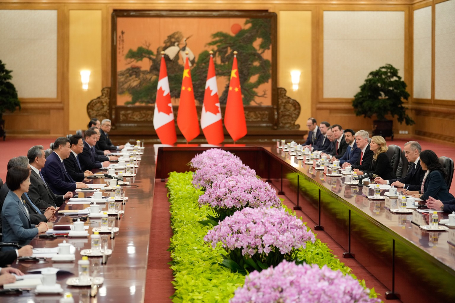 Chinese President Xi Jinping, left center, Canada's Prime Minister Mark Carney, second from right, talk during a meeting at the Great Hall of the People in Beijing, China, Friday, Jan. 16, 2026.  ...