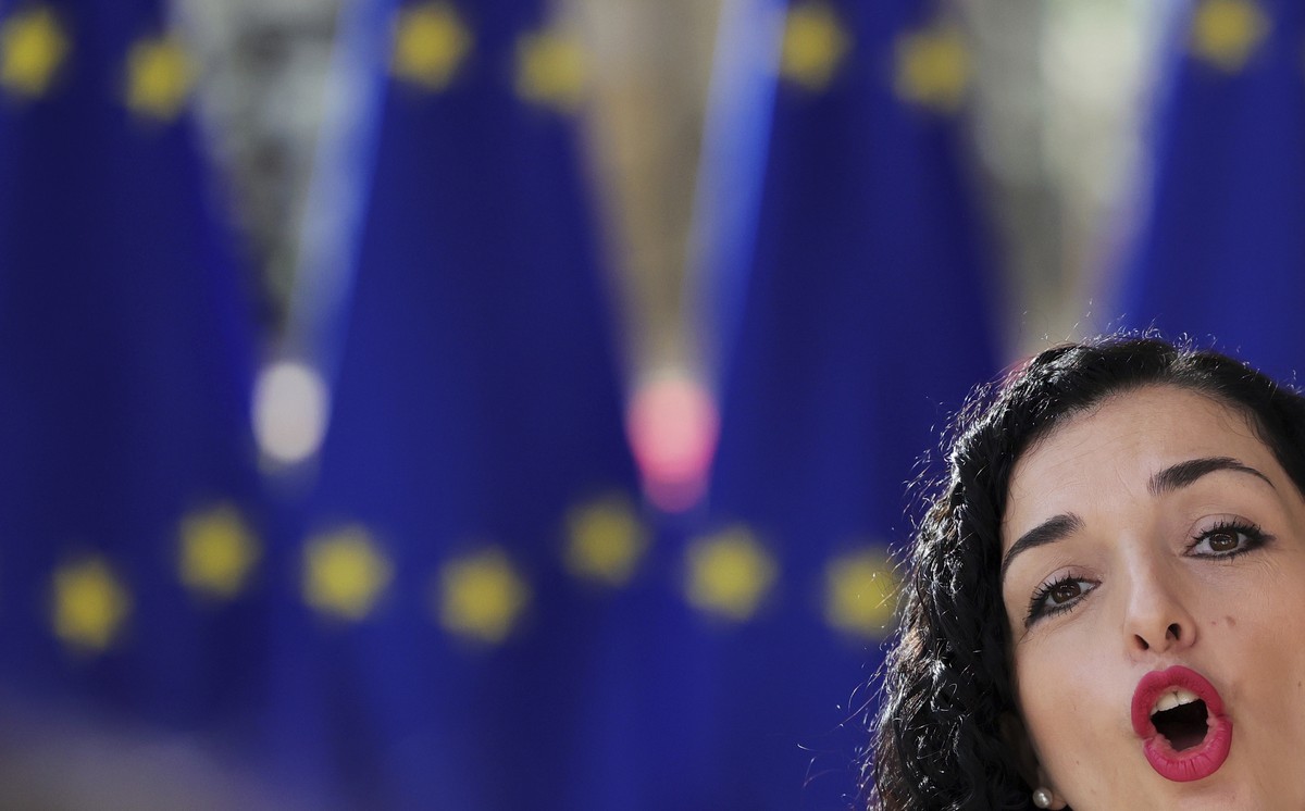 Kosovo President Vjosa Osmani Sadriu speaks with the media as she arrives for an EU summit in Brussels, Thursday, June 23, 2022. European Union leaders are expected to approve Thursday a proposal to g ...