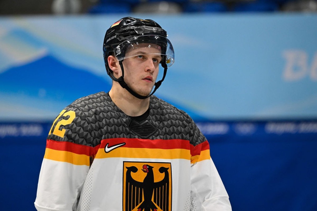 BEIJING, CHINA - FEBRUARY 15: Dominik Kahun of Germany looks dejected after the men's ice hockey playoff qualifications match between Slovakia and Germany during the Beijing 2022 Winter Olympics  ...