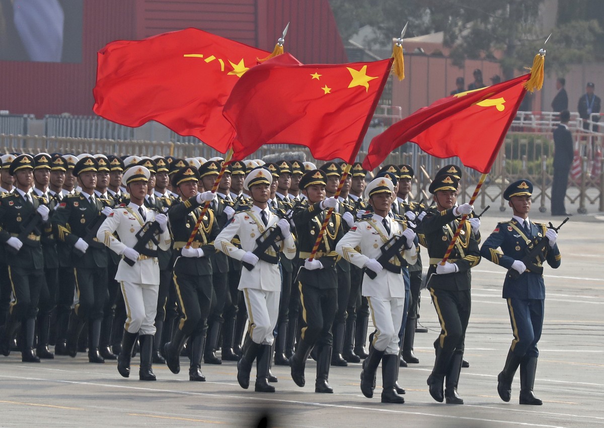 Chinese solders march during a parade to commemorate the 70th anniversary of the founding of Communist China in Beijing, Tuesday, Oct. 1, 2019. (AP Photo/Ng Han Guan)