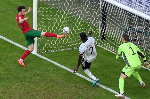 epa09286420 Diogo Jota of Portugal scores the 2-4 goal during the UEFA EURO 2020 group F preliminary round soccer match between Portugal and Germany in Munich, Germany, 19 June 2021. EPA/Matthias Hang ...