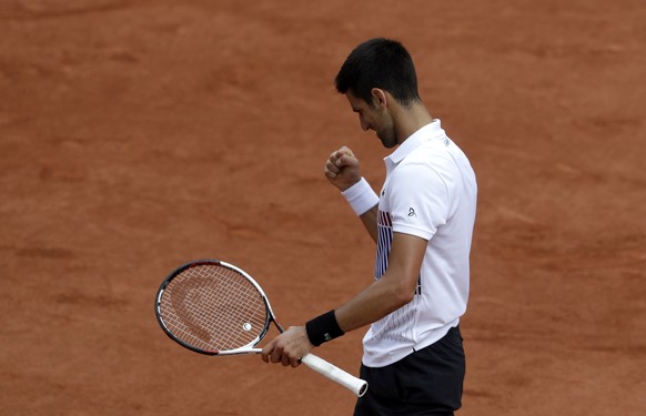 Serbia&#039;s Novak Djokovic reacts as he plays Argentina&#039;s Diego Schwartzman during their third round match of the French Open tennis tournament at the Roland Garros stadium, Friday, June 2, 201 ...