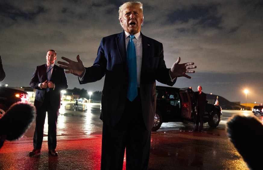 President Donald Trump talks with reporters at Andrews Air Force Base after attending a campaign rally in Latrobe, Pa., Thursday, Sept. 3, 2020, at Andrews Air Force Base, Md. (AP Photo/Evan Vucci)
Do ...