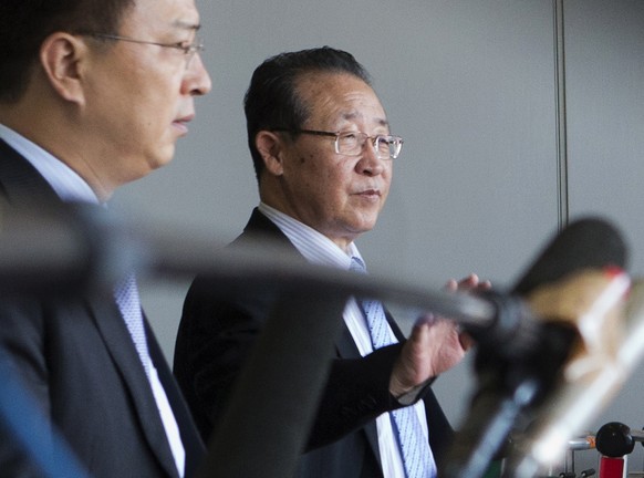 FILE - In this June 18, 2013 file photo, North Korea&#039;s First Vice Foreign Minister Kim Kye Gwan, right, waves as he arrives at the Capital airport in Beijing, China. Kim Kye Gwan and Choe Son Hui ...