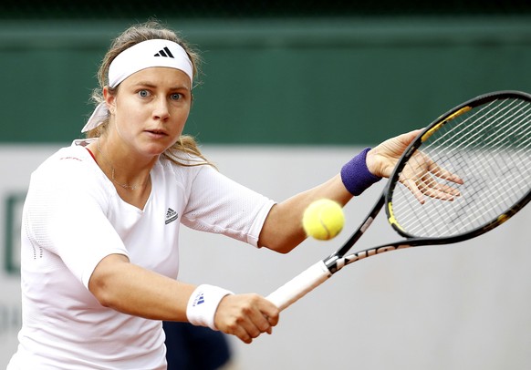 Stefanie Voegele of Switzerland plays a shot to Vitalia Diatchenko of Russia during their women&#039;s singles match at the French Open tennis tournament at the Roland Garros stadium in Paris, France, ...