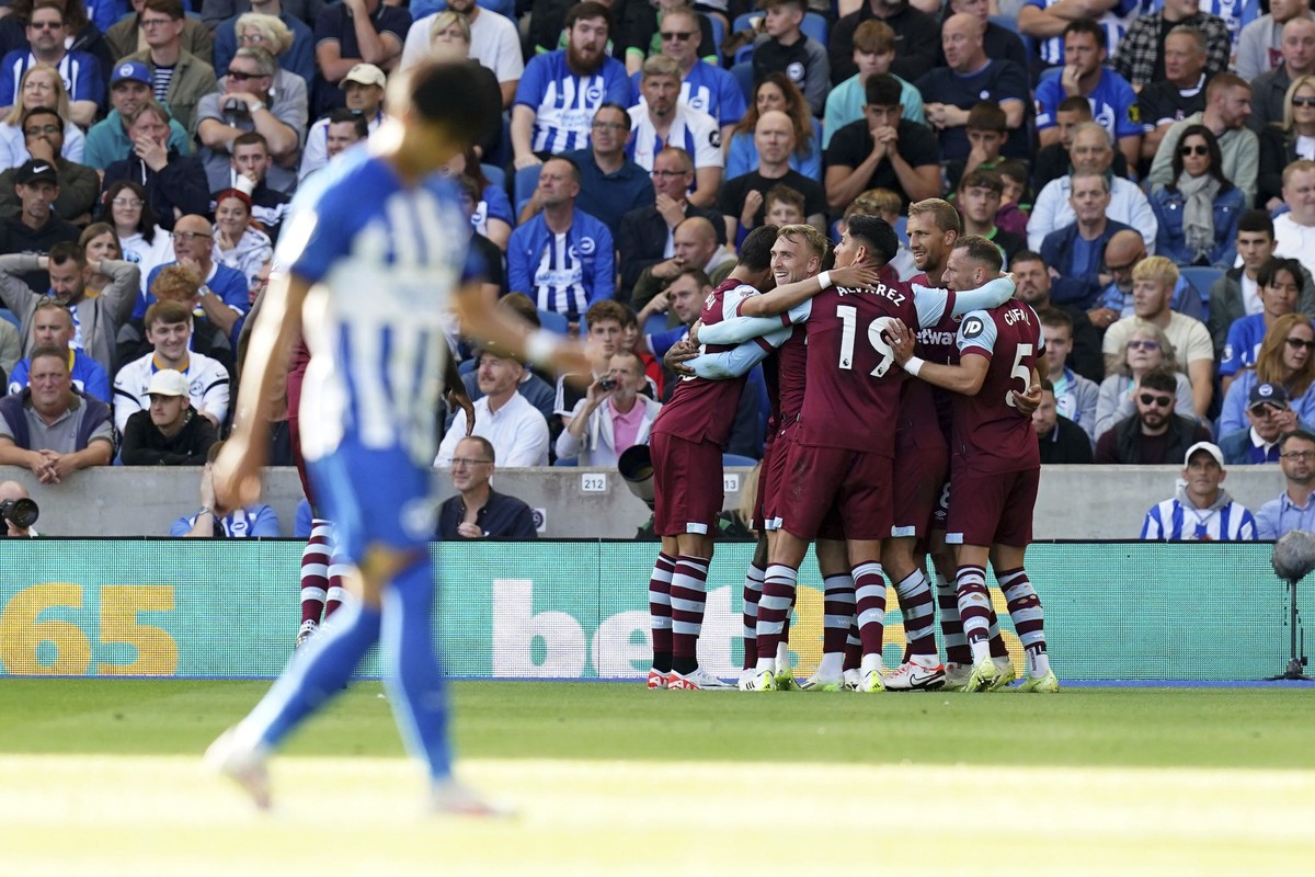 West Ham United's James Ward-Prowse celebrates with teammates after scoring his side's first goal, during the English Premier League soccer match between Brighton &amp; Hove and West Ham Unt ...