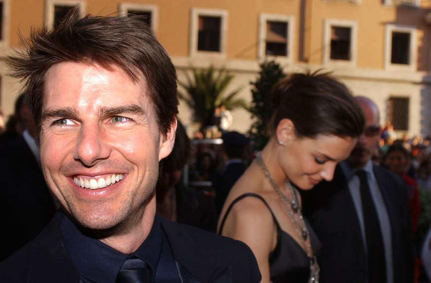 US actors Tom Cruise, left, and Katie Holmes arrive on Via della Conciliazione boulevard near St. Peter&#039;s Basilica, at the St. Cecilia auditorium for the David di Donatello Italian film awards, i ...