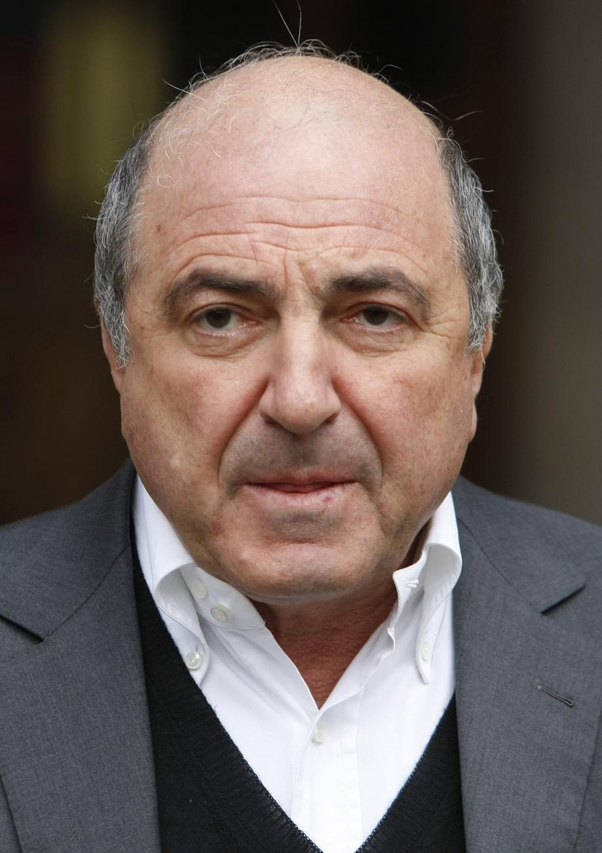 Self-exiled oligarch Boris Berezovsky leaves the High Court in London, Wednesday, March, 10, 2010, after winning his libel case against a Russian broadcaster that accused him of masterminding the murd ...