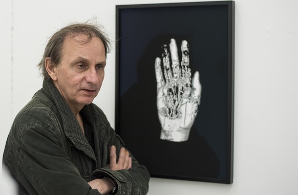 French Artist Michel Houellebecq watches his artwork &quot;Matiere from the series Michel Houellebecq OK?&quot;, at the Helmhaus during the press and preview day of the european biennale of contempora ...