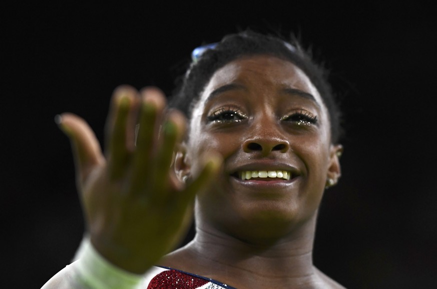 2016 Rio Olympics - Artistic Gymnastics - Final - Women&#039;s Individual All-Around Final - Rio Olympic Arena - Rio de Janeiro, Brazil - 11/08/2016. Simone Biles (USA) of the U.S. reacts after winnin ...