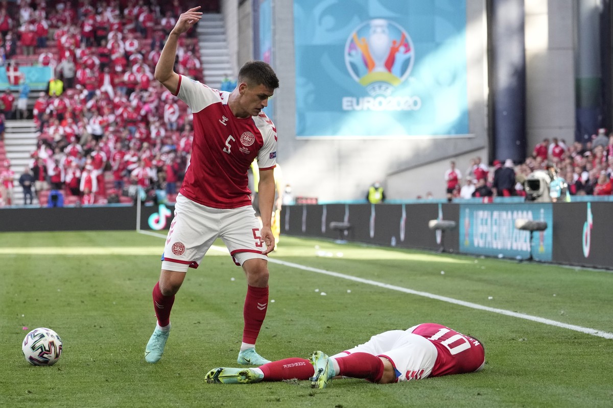 FILE - Denmark's Joakim Maehle reacts as Denmark's Christian Eriksen lies on the pitch after collapsing during the Euro 2020 soccer championship group B match against Finland at Parken stadi ...