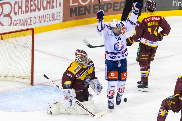 Chris Baltisberger (ZSC) #14 celebrates the goal after than his teammate scoring the 1:3, during a National League regular season game of the Swiss Championship between Geneve-Servette HC, GSHC, and Z ...