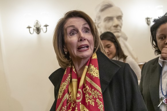 In this Jan. 23, 2019, photo House Speaker Nancy Pelosi responds to reporters after officially postponing President Donald Trump&#039;s State of the Union address until the government is fully reopene ...