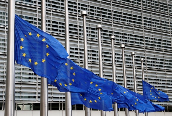 European Union flags are lowered at half-mast in honor of the victims of the Bastille Day truck attack in Nice, outside the EU Commission headquarters in Brussels, Belgium, July 15, 2016. REUTERS/Fran ...