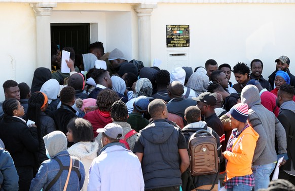 epa10498773 Ivorian migrants gather in front of the Ivory Coast embassy for their repatriation in Tunis, Tunisia, 02 March 2023. The embassy of Ivory Coast in Tunisia has launched a census operation o ...