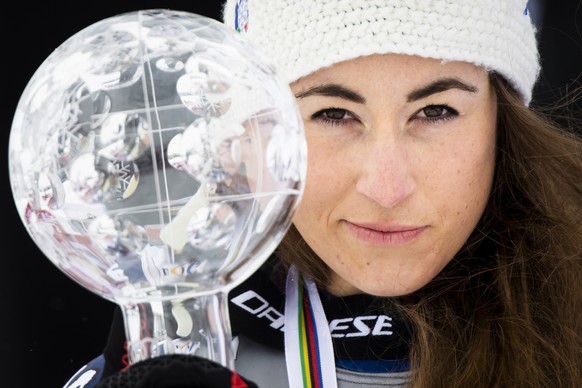 epaselect epa09079509 Sofia Goggia of Italy celebrates with the crystal globe of the overall women&#039;s Downhill competition during the podium ceremony at the FIS Alpine Skiing World Cup finals, in  ...