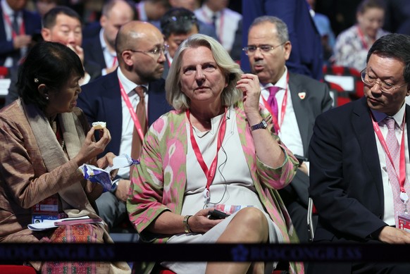 epa10856038 Former Austrian Foreign Minister Karin Kneissl (C) attends a plenary session of 2023 Eastern Economic Forum (EEF) at the Far Eastern Federal University on Russky Island in Vladivostok, Rus ...