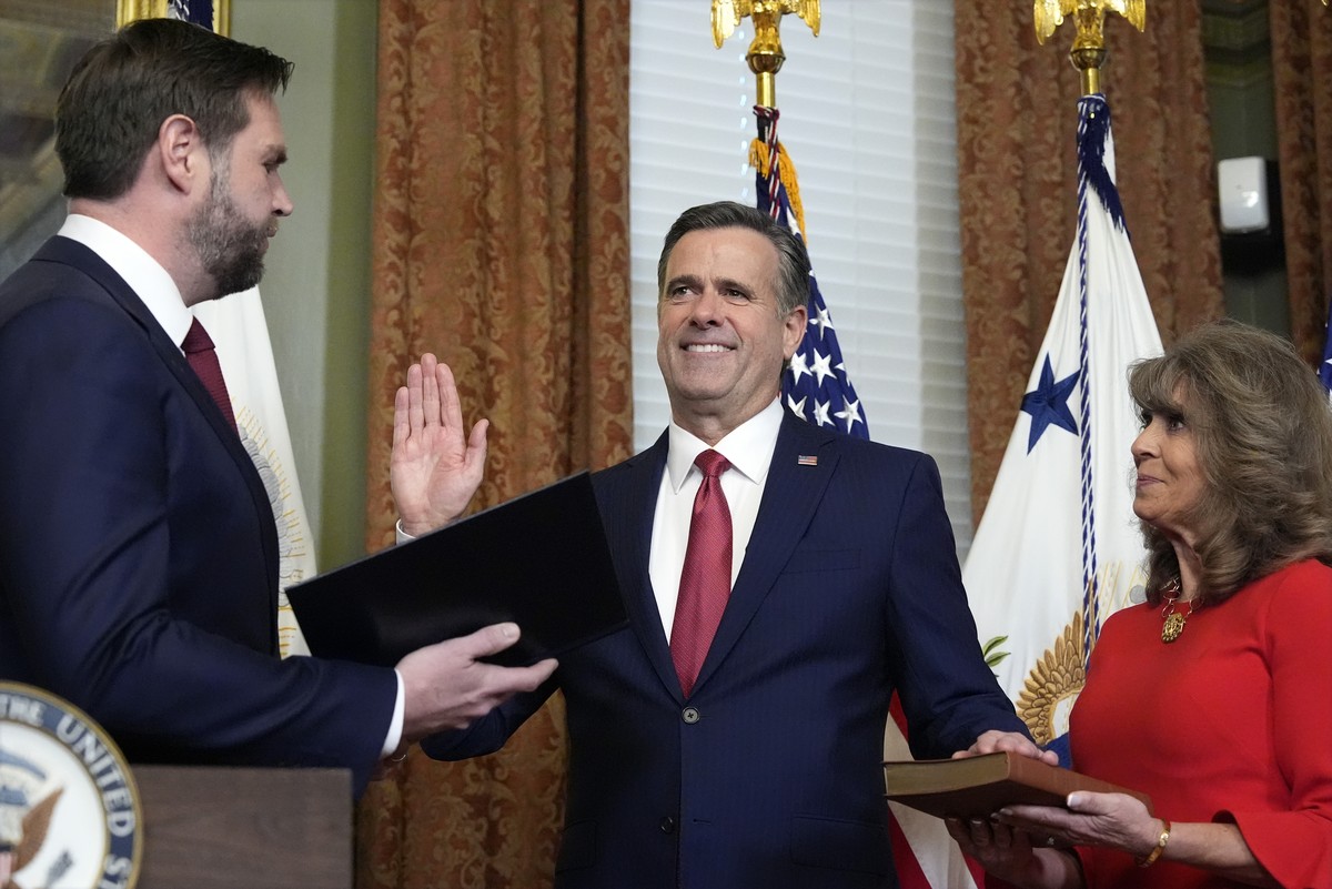 Vice President JD Vance swears in John Ratcliffe as CIA Director as his wife Michele holds the Bible in the Vice Presidential ceremonial office in the Eisenhower Executive Office Building on the White ...