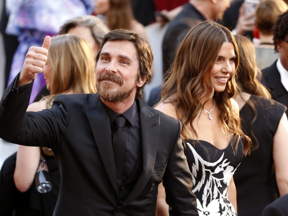 Christian Bale, left, and Sibi Blazic arrive at the Oscars on Sunday, Feb. 24, 2019, at the Dolby Theatre in Los Angeles. (Photo by Eric Jamison/Invision/AP)