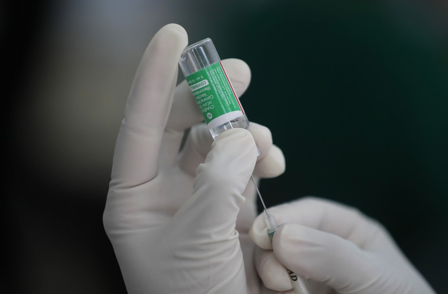 A Sri Lankan nurse administers a COVID-19 vaccine to an army soldier in Colombo, Sri Lanka, Friday, Jan. 29, 2021. Sri Lanka has begun inoculating frontline health workers, military troops and police  ...