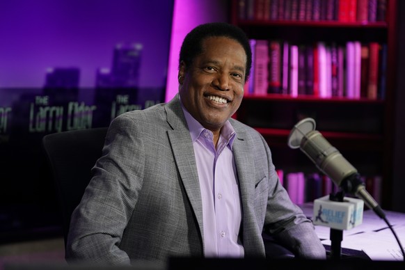 FILE - In this July 12, 2021 file photo, radio talk show host Larry Elder poses for a photo in his studio in Burbank, Calif. Elder, the leading Republican candidate in the California recall election t ...