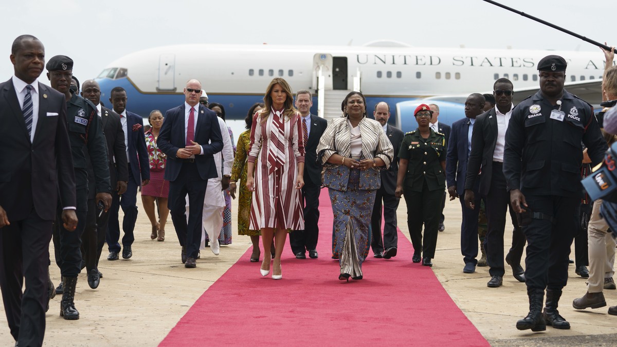 First lady Melania Trump walks with Ghana's first lady Rebecca Akufo-Addo as she arrives at Kotoka International Airport in Accra, Ghana, Tuesday, Oct. 2, 2018. First lady Melania Trump is visiti ...