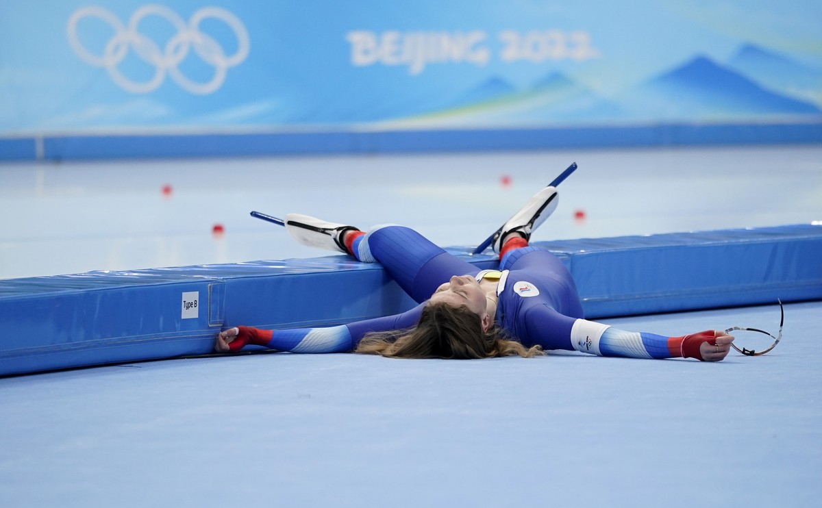 Olga Fatkulina of the Russian Olympic Committee flops onto the infield after finishing her heat in the women's speedskating 1,000-meter finals at the 2022 Winter Olympics, Thursday, Feb. 17, 2022 ...