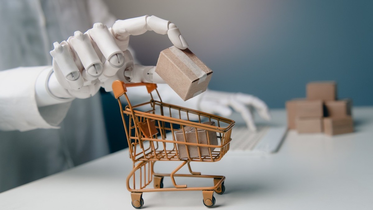 Robotic Hand Putting Cardboard Package in Shopping Trolley with Keyboard Background