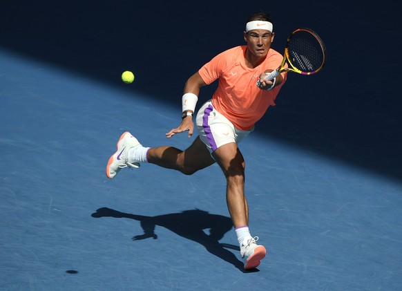 Spain&#039;s Rafael Nadal hits a forehand return to Italy&#039;s Fabio Fognini during their fourth round match at the Australian Open tennis championship in Melbourne, Australia, Monday, Feb. 15, 2021 ...