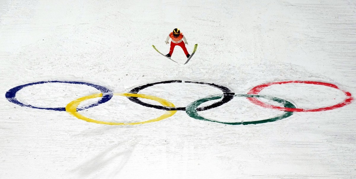 epa09755465 Simon Ammann of Switzerland during the Men's Team Ski Jumping Large Hill final at the Zhangjiakou National Ski Jumping Centre at the Beijing 2022 Olympic Games, Zhangjiakou, China, 14 ...