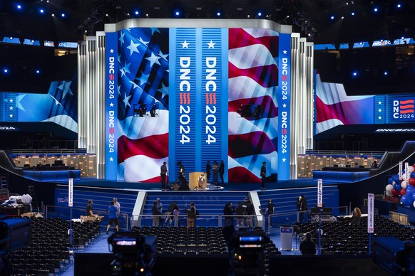 Workers prepare for next week&#039;s Democratic National Convention at the United Center in Chicago, Thursday, Aug. 15, 2024. (AP Photo/J. Scott Applewhite)