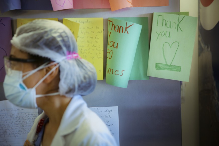 FILE - In this May 29, 2020, file photo, letters of thanks from students adorn the walls of a break room that was set up for workers to decompress from the stresses of caring for COVID-19 patients at  ...