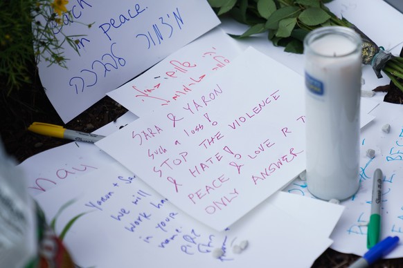 epa12126597 Tributes are left at the scene where two people were shot and killed near the Capital Jewish Museum in Washington, DC, USA, 22 May 2025. According to a social media post by the US Homeland ...