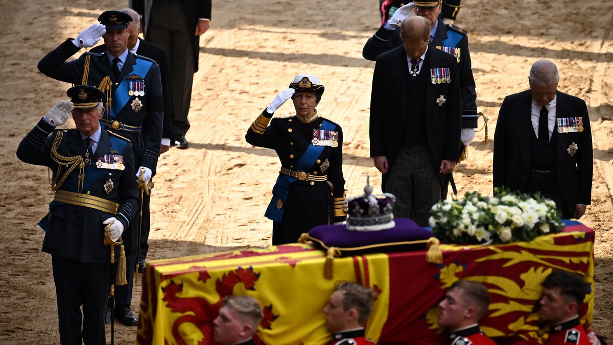 Britain's King Charles III, Britain's Prince William, Britain's Princess Anne, salute alongside Britain's Prince Andrew, as the coffin of Queen Elizabeth II, adorned with a Royal S ...